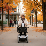 Senior woman riding a motorized mobility scooter outdoors in Canada on a sunny day