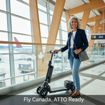 A senior traveler with a sleek ATTO folding mobility scooter in a bright Canadian airport, ready for flight. The image highlights the scooter's compact design for air travel, emphasizing ease and independence. Headline: Fly Canada, ATTO Ready.