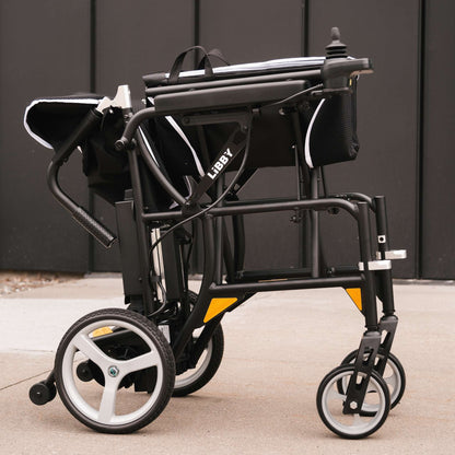Close-up of the LIBBY branding on the power wheelchair frame