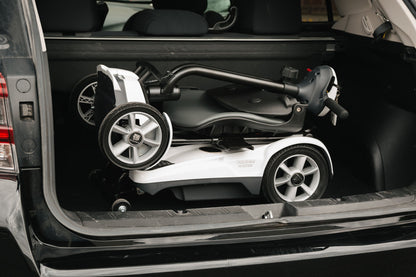Heartway Transit 4 folded in a car boot showing compact storage size
