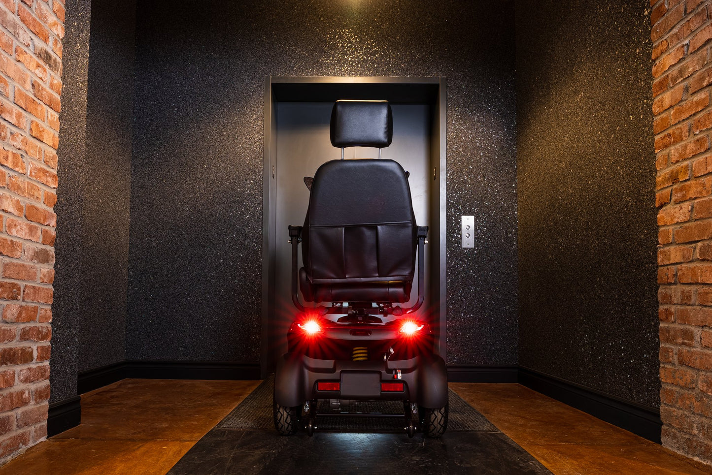 Blue Movo Sutton mobility scooter photographed outside a stone building