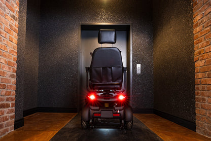 Blue Movo Sutton mobility scooter photographed outside a stone building