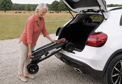Movo Pilot folded flat and lying in a car boot leaving luggage space