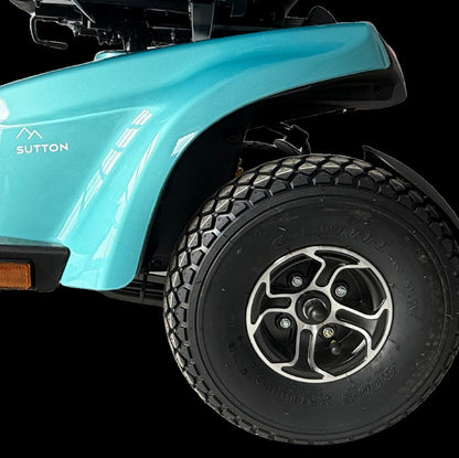 Close-up of the Movo Sutton front body panel, badge and all-terrain tyre